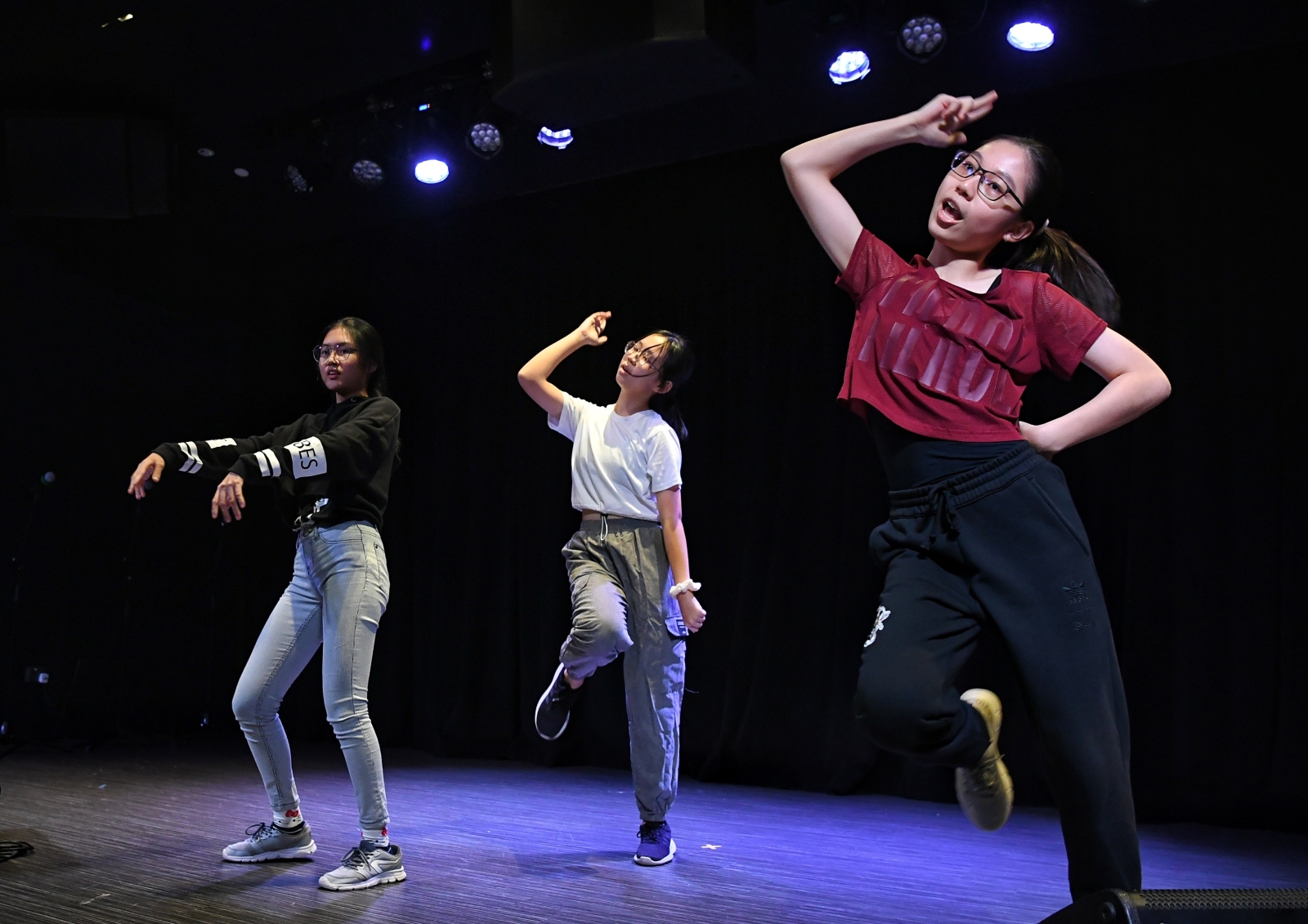 From left: Charis Teh, Jaslyn Tan and Maevya Xu, 16, performs a Kpop dance during the auditions for the 18th ChildAid concert on August 13, 2022  ST PHOTO: CHONG JUN LIANG